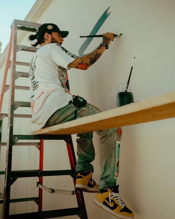 Alpha Remodeling painter applying a fresh coat