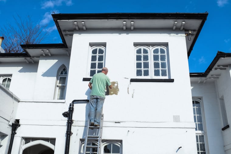 Alpha Remodeling professional preparing a home exterior